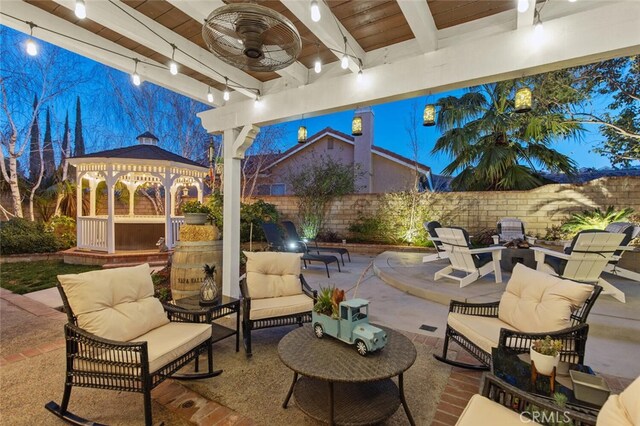 view of patio / terrace with a gazebo, ceiling fan, and outdoor lounge area