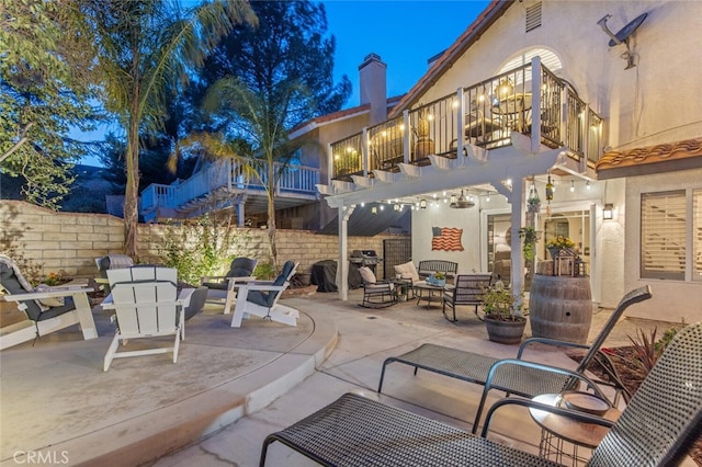 view of patio featuring a balcony, fence, a pergola, and area for grilling