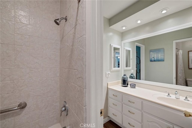 bathroom with shower / bath combo with shower curtain and vanity