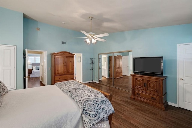 bedroom with vaulted ceiling, ceiling fan, and dark hardwood / wood-style floors