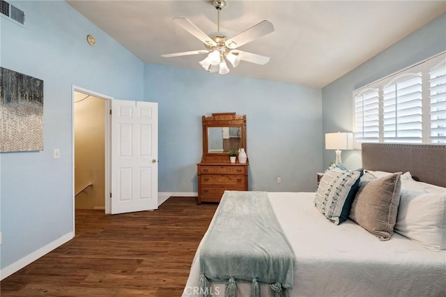 bedroom with lofted ceiling, dark wood-type flooring, and ceiling fan