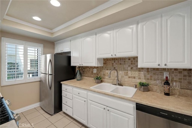 kitchen with sink, stainless steel appliances, white cabinets, and light tile patterned floors