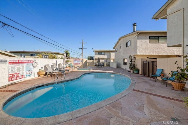 view of swimming pool with a patio