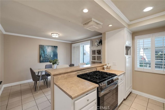 kitchen featuring kitchen peninsula, light tile patterned floors, gas stove, and white cabinetry