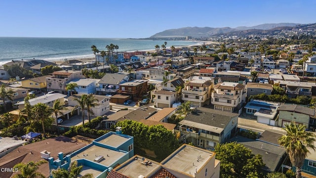 birds eye view of property featuring a water and mountain view