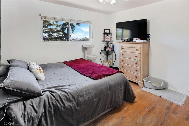 bedroom with light hardwood / wood-style flooring