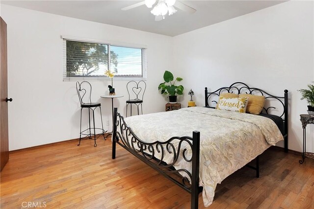 bedroom featuring ceiling fan and wood-type flooring