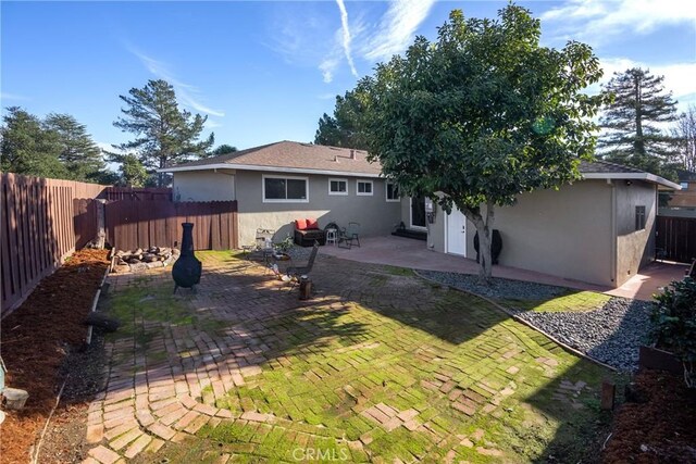 back of property featuring a patio area