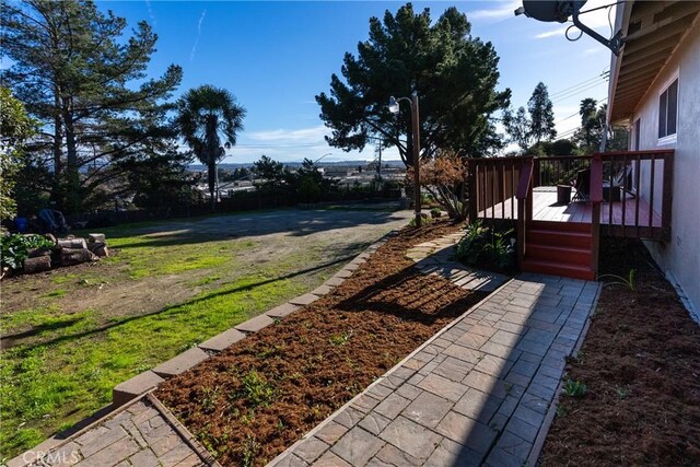 view of yard featuring a wooden deck