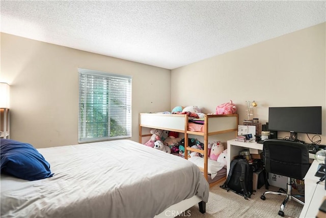 carpeted bedroom with a textured ceiling