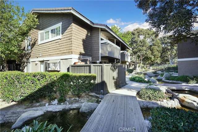 view of side of property featuring a balcony