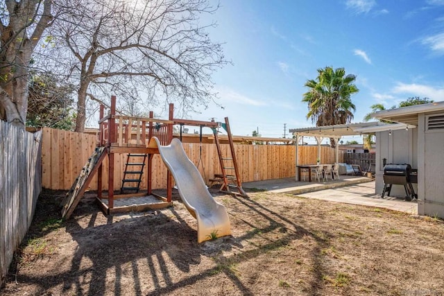 view of jungle gym with a patio area