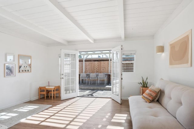 living room featuring beam ceiling, french doors, and dark hardwood / wood-style flooring