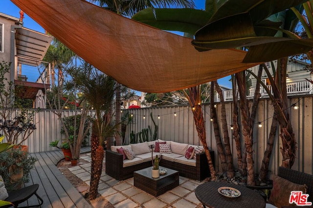 wooden terrace with outdoor lounge area