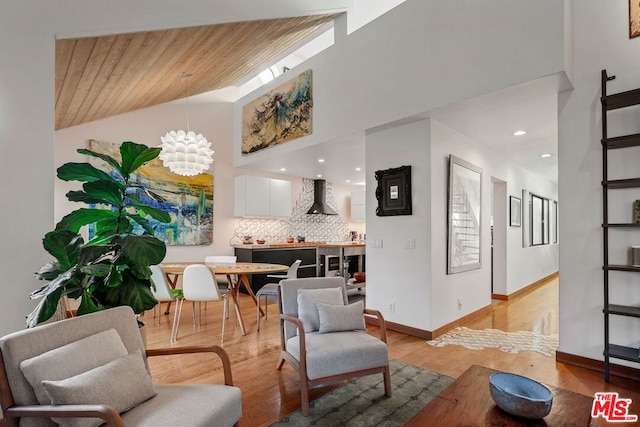 living room with vaulted ceiling, wood ceiling, and light wood-type flooring