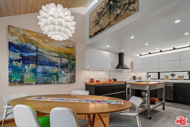 dining room featuring wooden ceiling, lofted ceiling, and an inviting chandelier