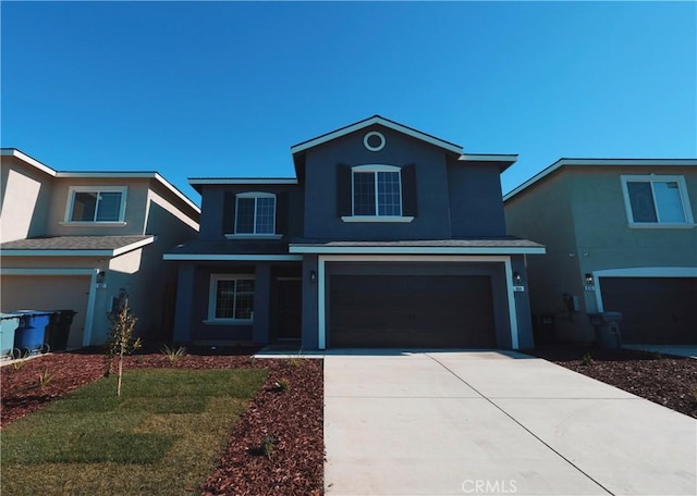 front of property featuring a garage and a front lawn