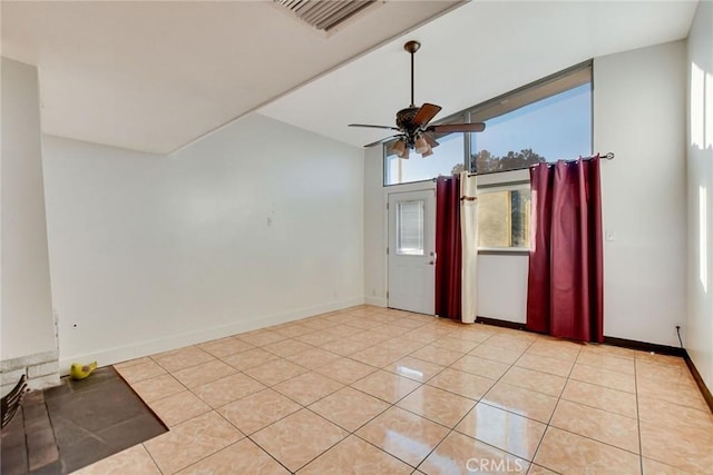 unfurnished room featuring light tile patterned flooring and ceiling fan