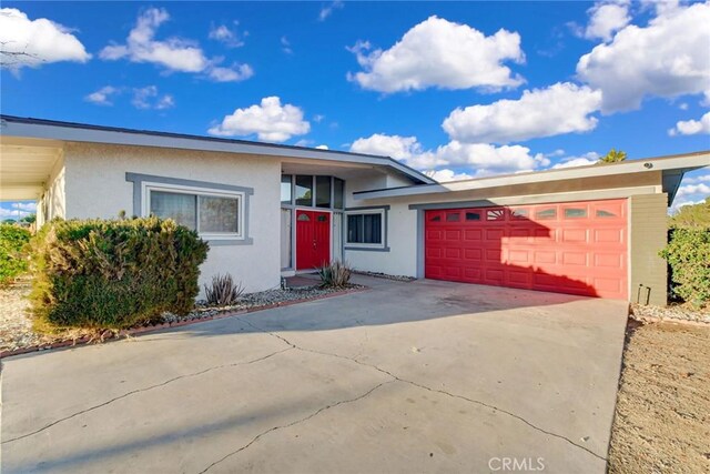 ranch-style house featuring a garage