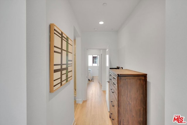 hall with light hardwood / wood-style flooring