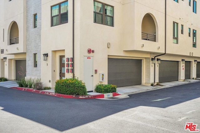 townhome / multi-family property featuring a garage