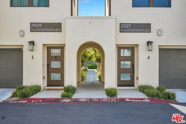 view of exterior entry featuring a garage