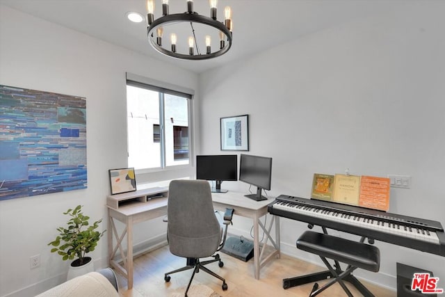 office with a notable chandelier and light hardwood / wood-style flooring