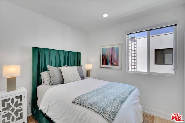 bedroom featuring wood-type flooring