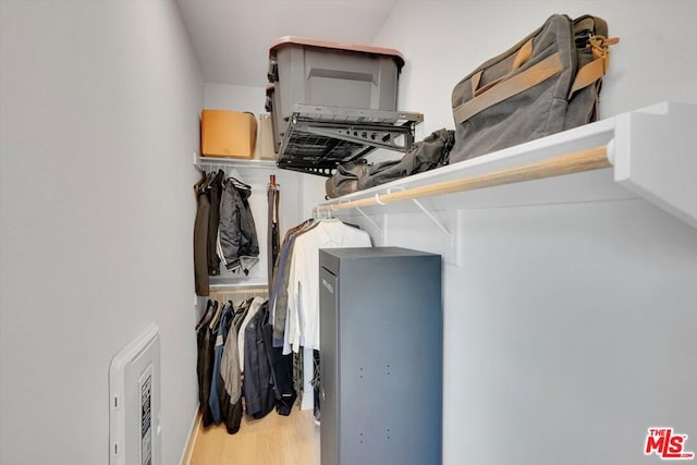 spacious closet featuring hardwood / wood-style flooring