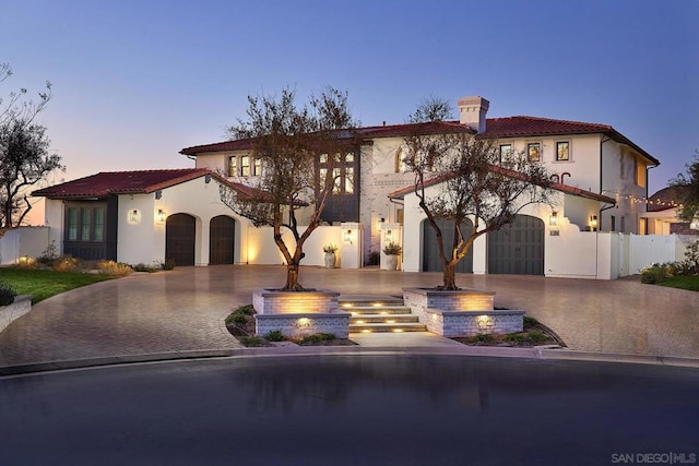 mediterranean / spanish-style home featuring a garage