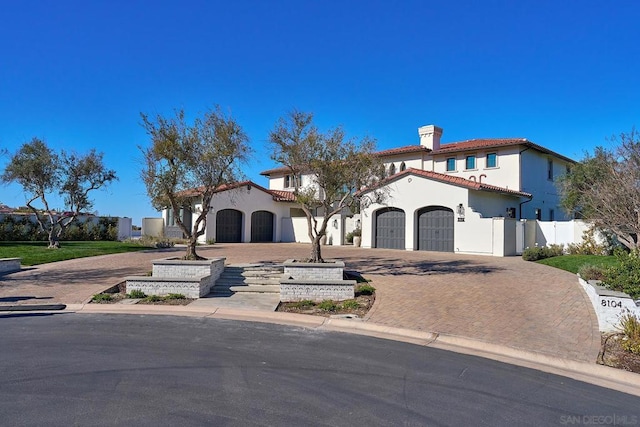 mediterranean / spanish-style house featuring a garage