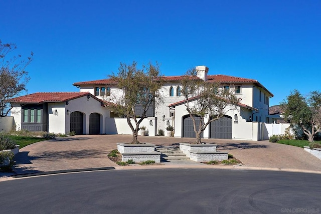 mediterranean / spanish house featuring a garage