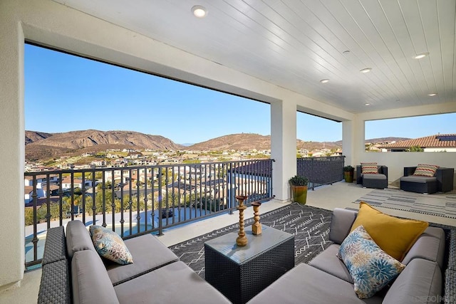 balcony with a mountain view and an outdoor living space