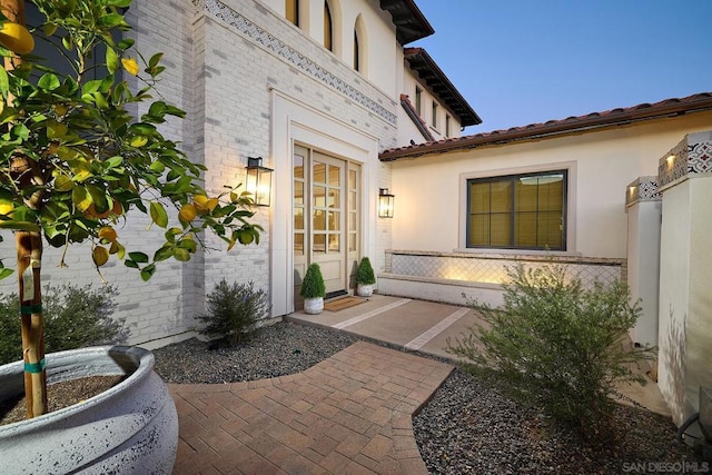 entrance to property with a patio area