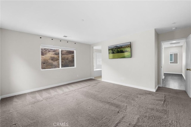 unfurnished room with carpet flooring