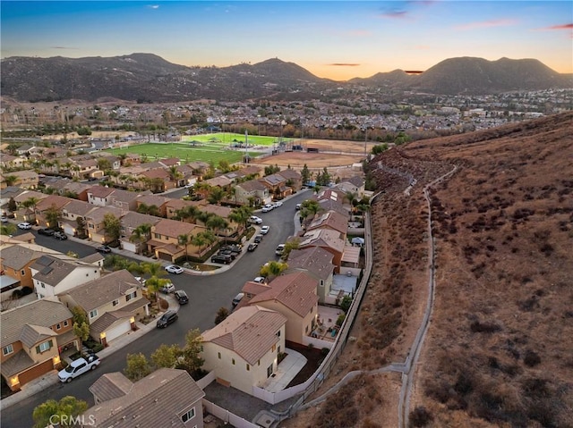 aerial view at dusk with a mountain view