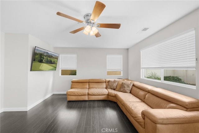 living room featuring dark hardwood / wood-style floors and ceiling fan