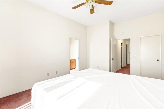 carpeted bedroom with ceiling fan and connected bathroom