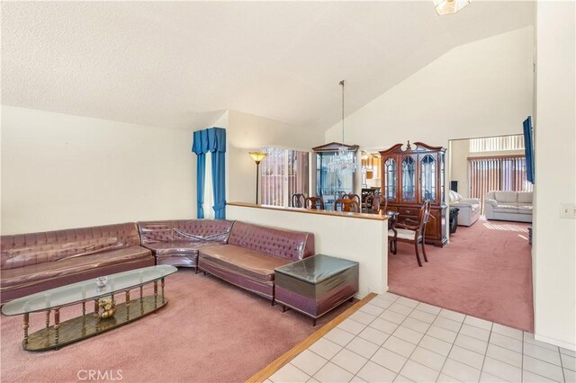 living room featuring lofted ceiling and light carpet