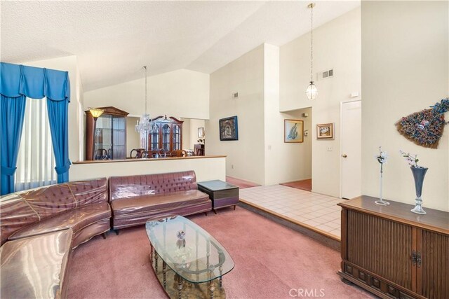 carpeted living room with vaulted ceiling