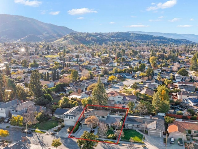 birds eye view of property with a mountain view