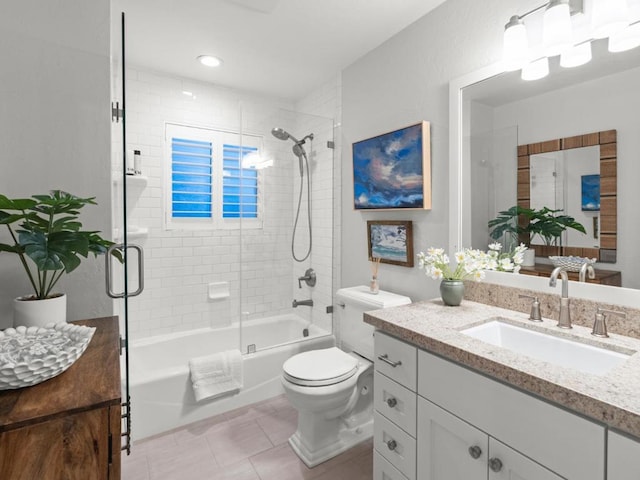 full bathroom featuring toilet, combined bath / shower with glass door, tile patterned flooring, and vanity