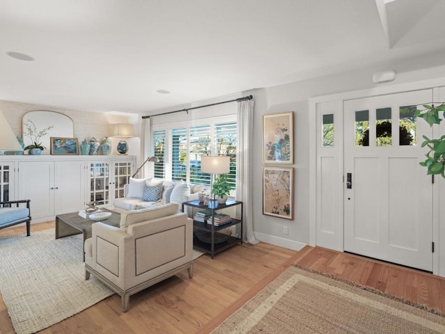 living room with light hardwood / wood-style flooring