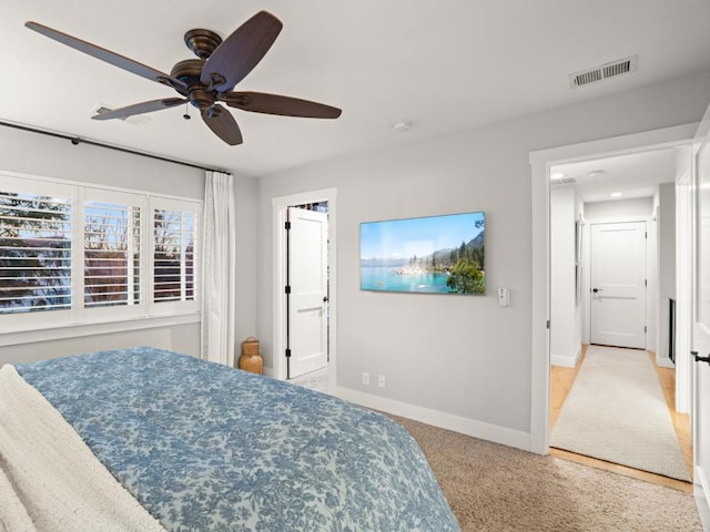 carpeted bedroom featuring ceiling fan