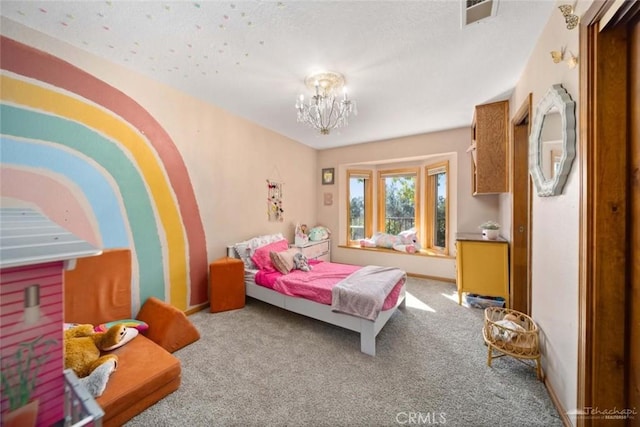 bedroom with an inviting chandelier and carpet flooring