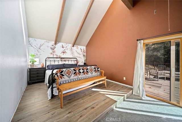 bedroom featuring hardwood / wood-style flooring, high vaulted ceiling, and beamed ceiling