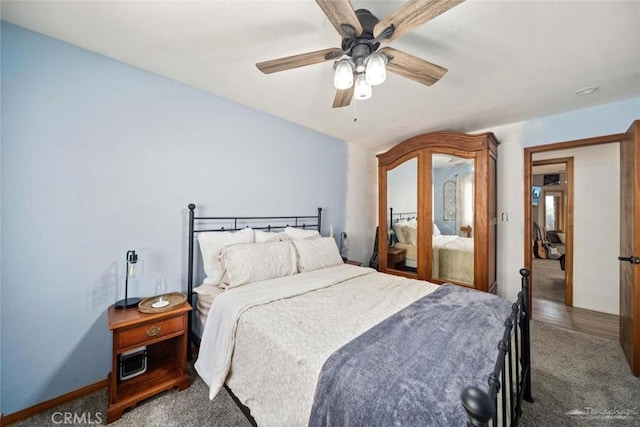 carpeted bedroom with ceiling fan