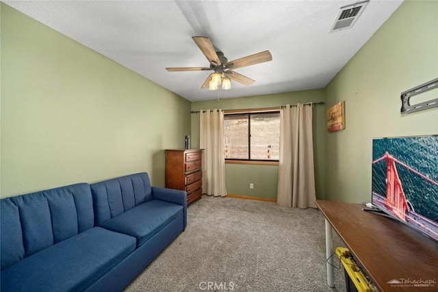 carpeted living room featuring ceiling fan