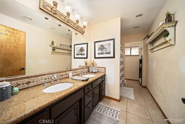 bathroom with vanity and tile patterned flooring