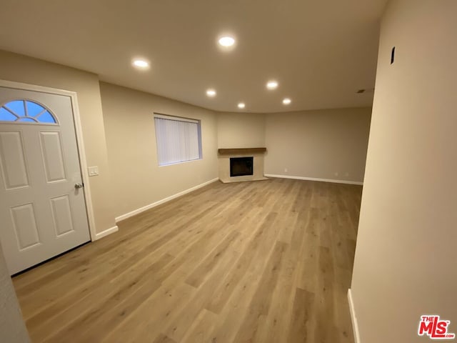 unfurnished living room with light hardwood / wood-style floors